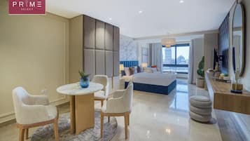 Deluxe Studio, River View | Living area | TV