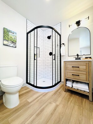 Combined shower/tub, hair dryer, towels, soap