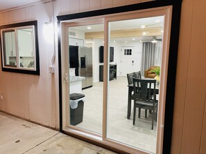 Enjoy meals and entertainment in this comfortable space with a dining area, kitchenette, and TV.