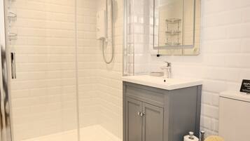 Shower, hair dryer, towels, soap