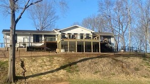 A large, two-story house with a covered porch and a garage.
