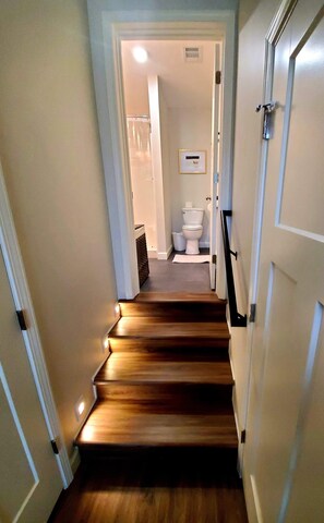 Combined shower/bathtub, towels, toilet paper