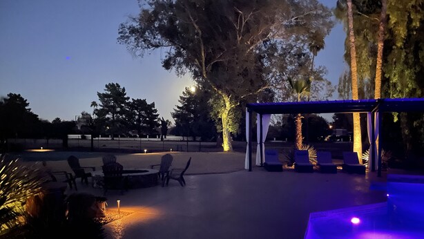 An outdoor patio area with seating and a covered section. - Chic Airstream on a 1 acre lot on the golf course in Scottsdale (Scottsdale)