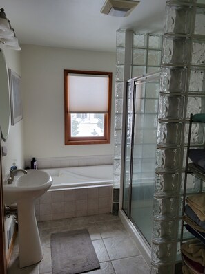 Bathtub, jetted tub, hair dryer, towels