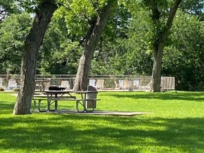 Outdoor dining - The Retreat @ Waterwheel | Guadalupe Riverfront | Heated Pools & 4 Hot Tubs (New Braunfels)