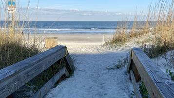 On the beach, sun loungers, beach towels