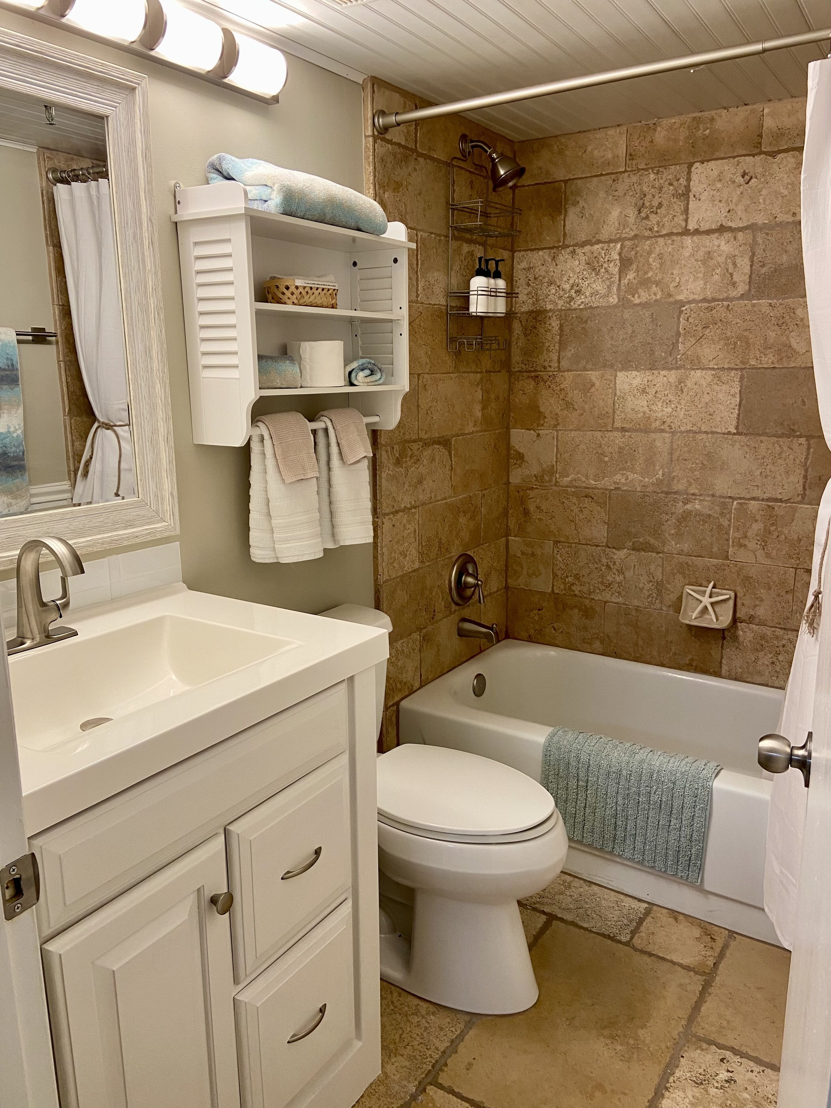 Combined shower/tub, hair dryer, towels, soap