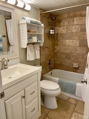 Combined shower/bathtub, hair dryer, towels, soap