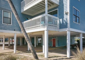A two-story building with a balcony on the upper floor.