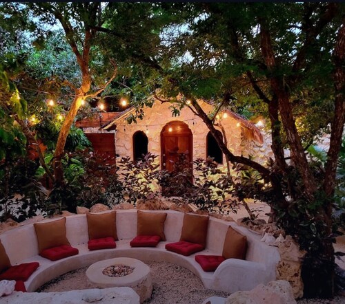 This home features lush garden & private pool.