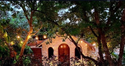 This home features lush garden & private pool.