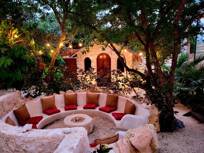 This home features lush garden & private pool.