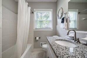 Combined shower/tub, hair dryer, towels, soap