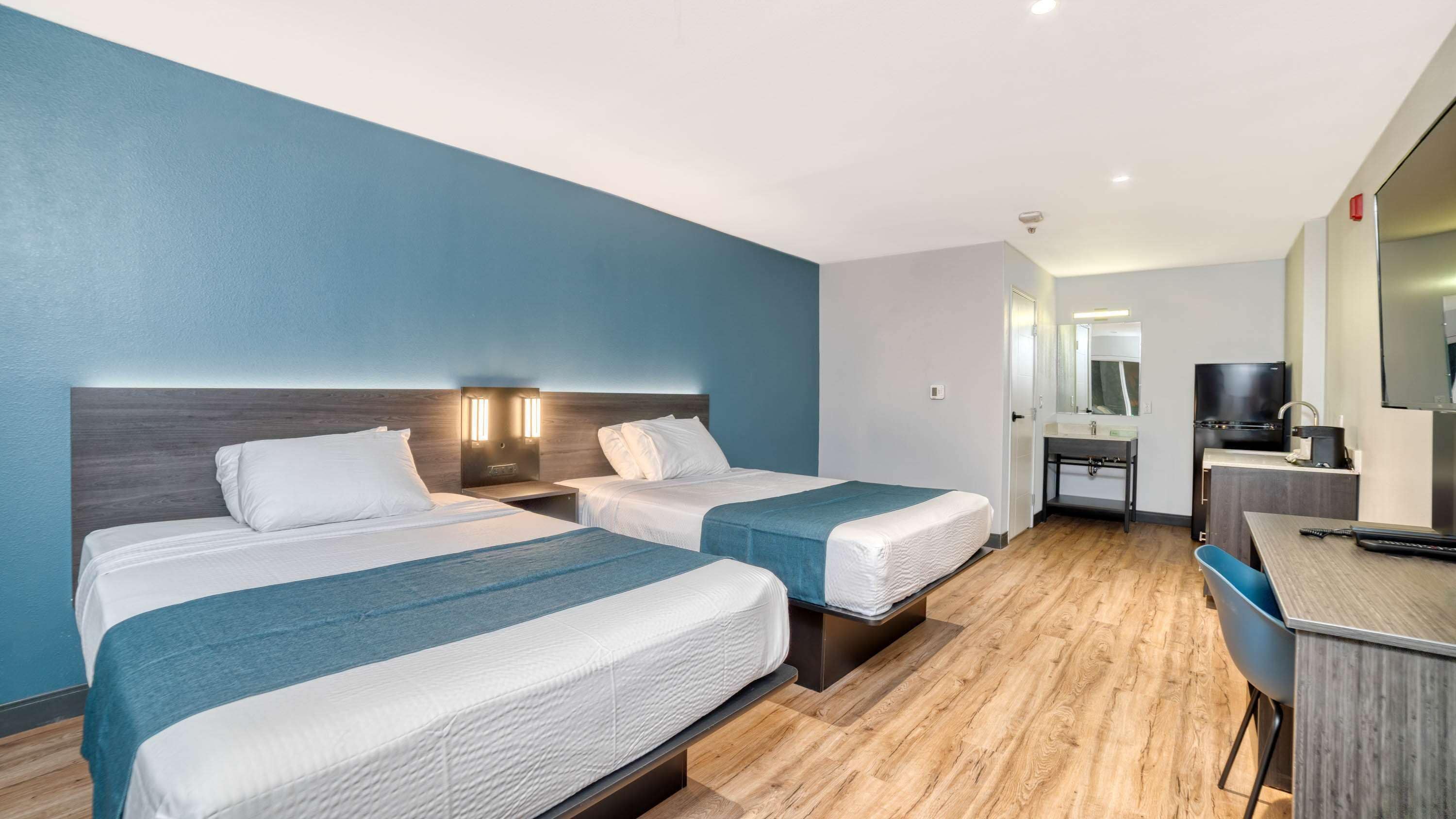 Premium bedding, Select Comfort beds, desk, iron/ironing board