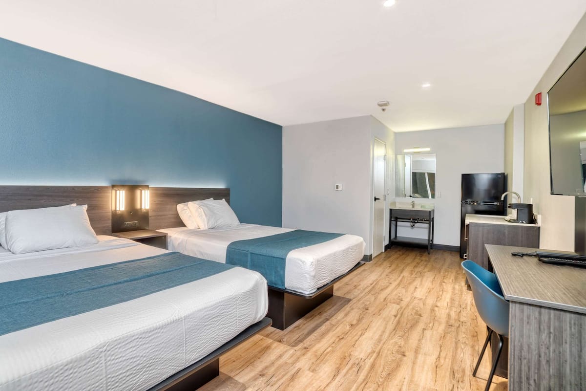 Premium bedding, Select Comfort beds, desk, iron/ironing board