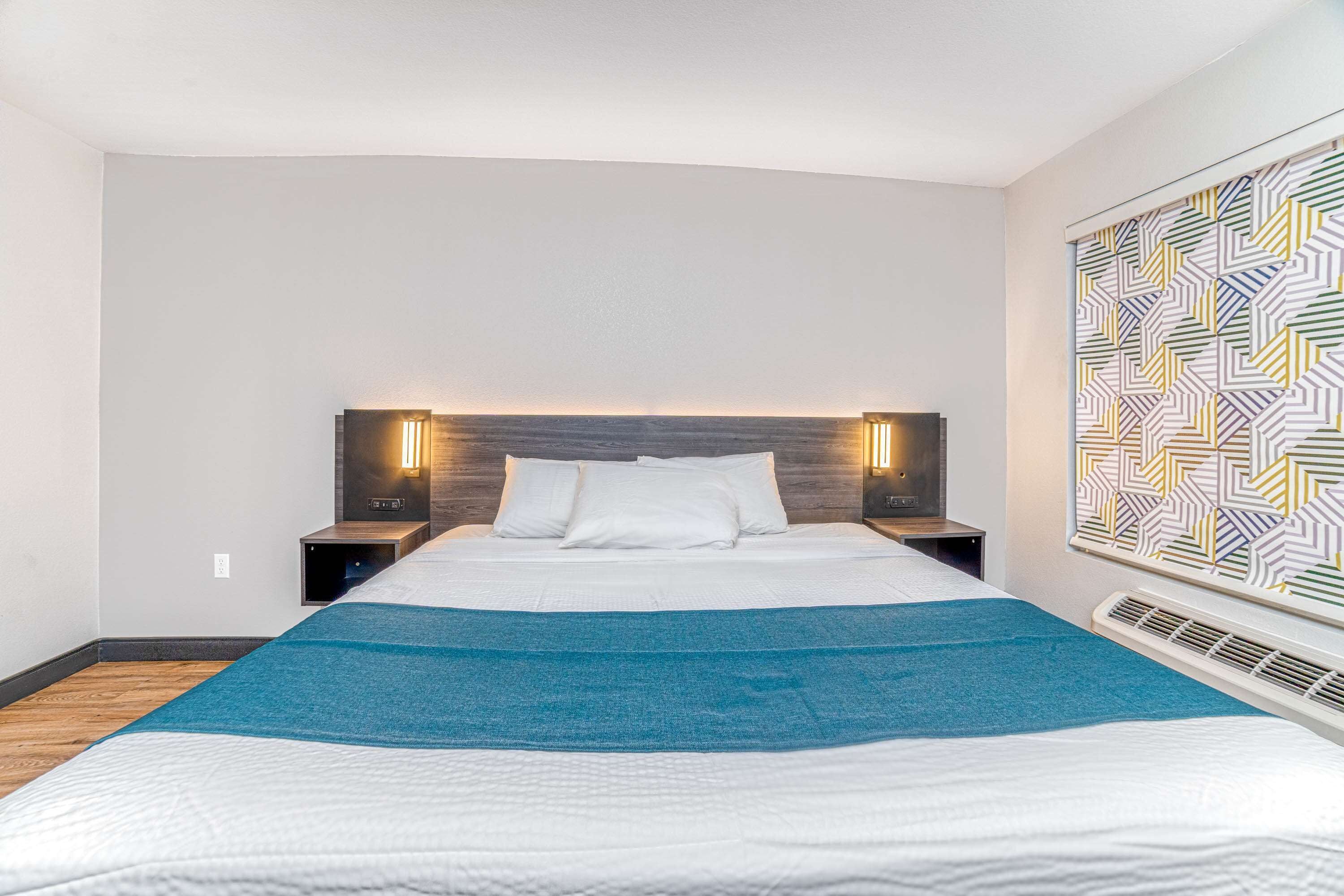 Premium bedding, Select Comfort beds, desk, iron/ironing board