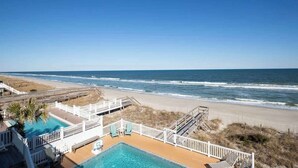 A beachfront hotel with a pool, beach access, and ocean views. - Dolphin Watch - 7Br - Oceanfront - Pool/Hot Tub (Kure Beach)