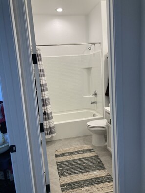 Combined shower/tub, hair dryer, towels, soap