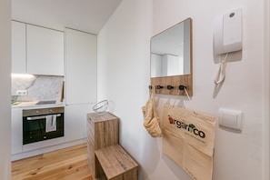 Enjoy cooking in this kitchenette with oven, cutting board, and ample counter space.