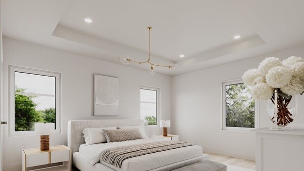 A modern bedroom with a large bed, bedside tables, a hanging light fixture, and a view of greenery outside. - Compound for Families- Main House with Adjacent Cottages Cabins,Indoor Pool Spa (Fennville)