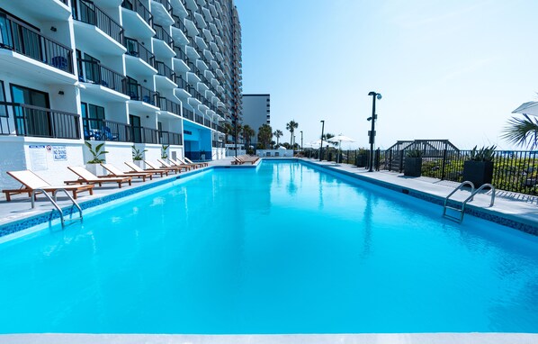 Outdoor pool, open 8:00 AM to 11:00 PM, pool loungers