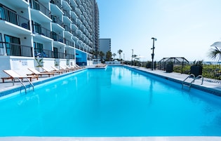 Outdoor pool, open 8:00 AM to 11:00 PM, pool loungers
