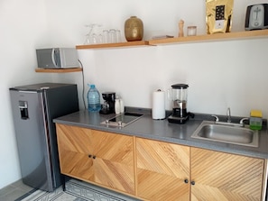 Fridge, microwave, stovetop, coffee/tea maker
