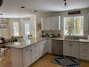 Enjoy cooking in this well-lit kitchen with a dishwasher and stainless steel appliances.