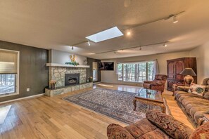 TV, fireplace, books