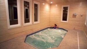 A room with a wooden interior, a hot tub, and a window with a view. - Steinhatchee Landing Resort -Cross Creek #2-Dog Friendly **THIRD NIGHT FREE** (Steinhatchee)