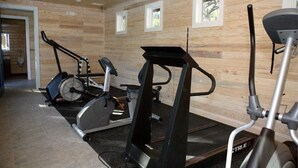 A gym with stationary bikes, a treadmill, and a rowing machine. - Steinhatchee Landing Resort -Cross Creek #2-Dog Friendly **THIRD NIGHT FREE** (Steinhatchee)
