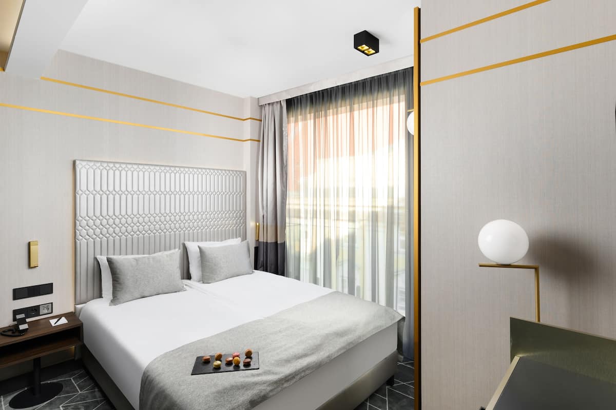 Economy | Hypoallergeen beddengoed, een minibar, een kluis op de kamer