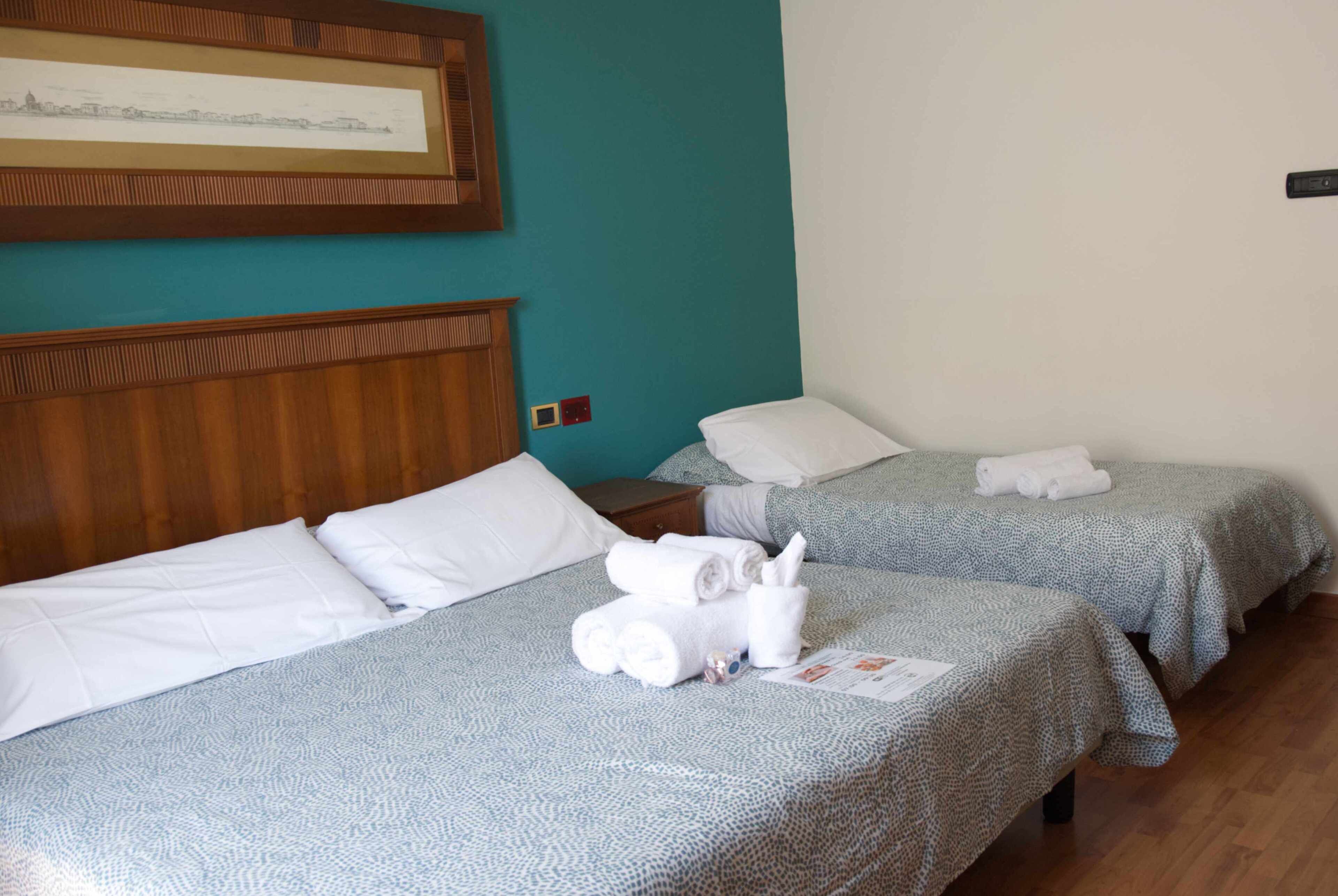 traditional quadruple room | down duvets, minibar, in-room safe, desk