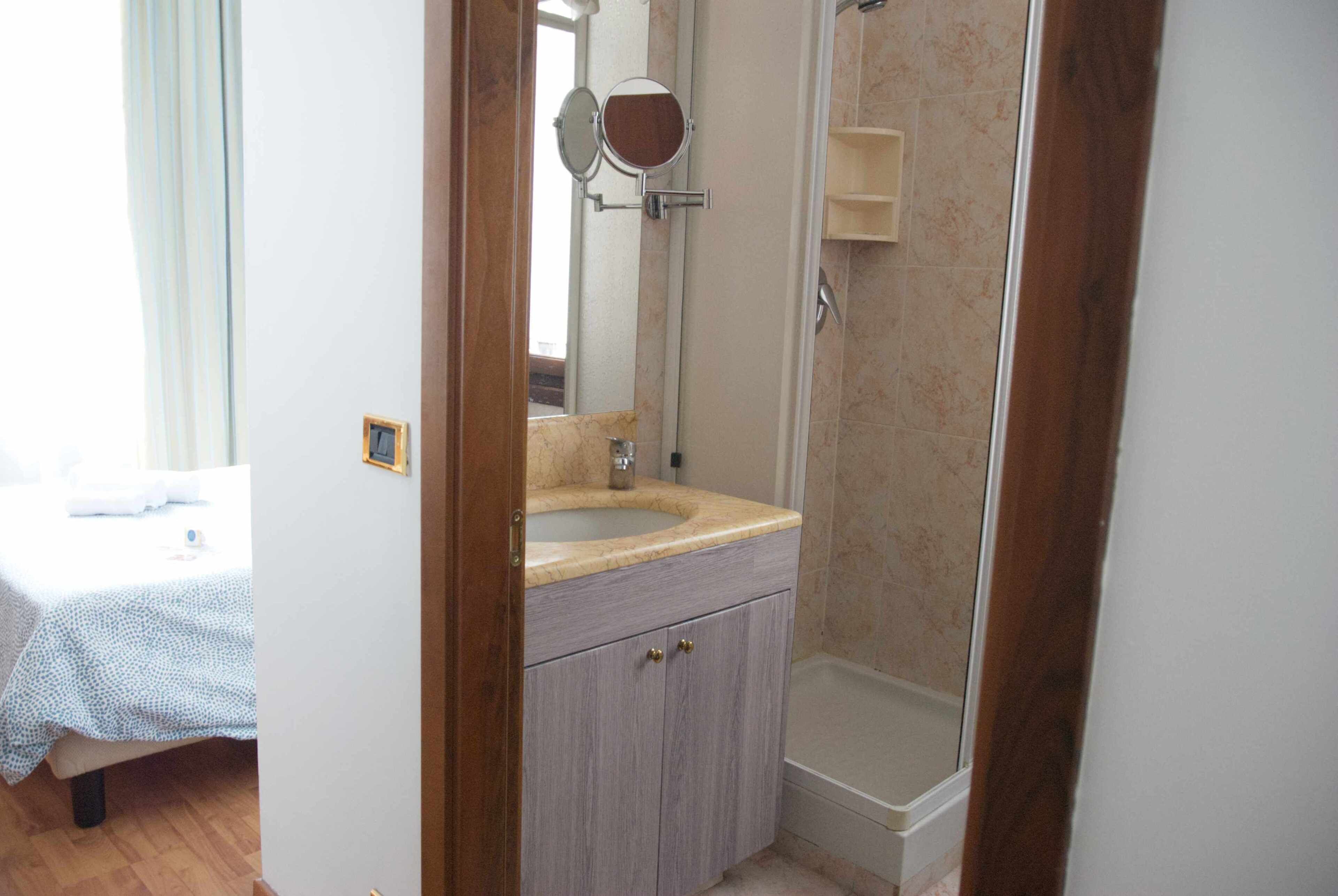 classic single room | bathroom | hair dryer, bidet, towels