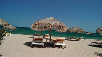 Private beach, beach umbrellas