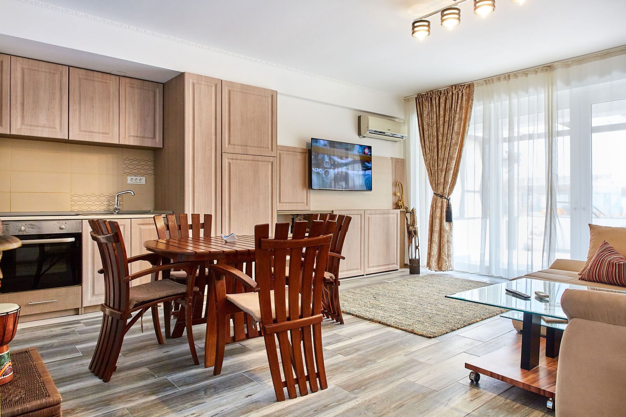 Luxury Apartment | Living area | 100-inch LED TV with satellite channels, TV