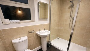 A bathroom with a toilet, sink, and shower. - The Park Hotel, Sure Hotel Collection by Best Western (Diss)