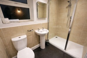A bathroom with a toilet, sink, and shower. - The Park Hotel, Sure Hotel Collection by Best Western (Diss)
