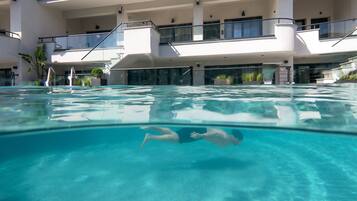 Seasonal outdoor pool, pool umbrellas, sun loungers