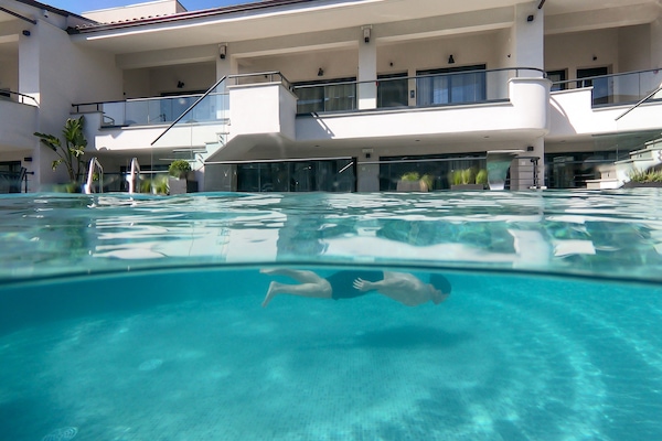 Seasonal outdoor pool, pool umbrellas, sun loungers