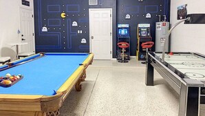 A pool table with balls, a pool cue, and a pool table with a blue felt surface. - Magical Express: Private Pool & 24/7 Support (Davenport)