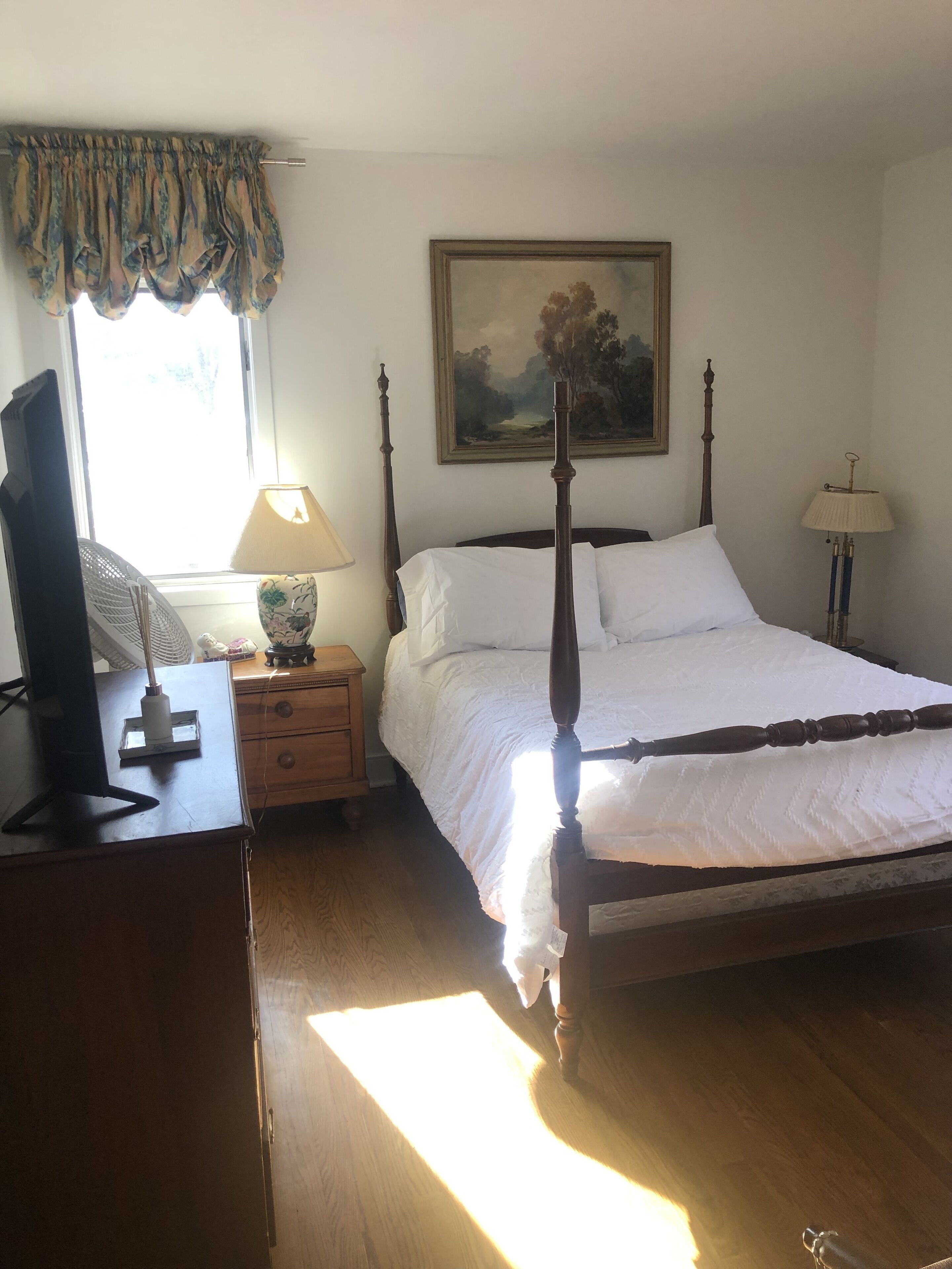 bedroom with full size bed.  Bedroom has a 45" smart tv.  