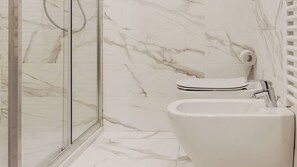 A bathroom with a glass-enclosed shower, a toilet, and a bidet. - Mi-brgz1a3 Bergonzoli Place - Bilo A - Dante (Milan)