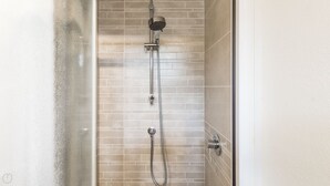 A shower with a handheld showerhead and a fixed wall-mounted showerhead, both with chrome finishes. - Italianway Easy - Paisiello 4 A (Milan)