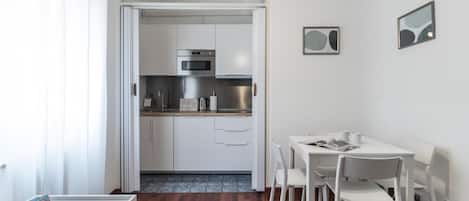 Apartment | Private kitchen | Fridge, microwave, stovetop, cookware/dishes/utensils