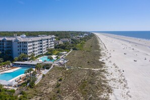 Enjoy stunning ocean views from the hotel's spacious balconies overlooking the sandy beach and lush surroundings.