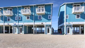 A beachfront building with multiple balconies and a covered entrance area. - Beachfront, Bayview, Relax ~ Edgewater Retreat (Cape San Blas)