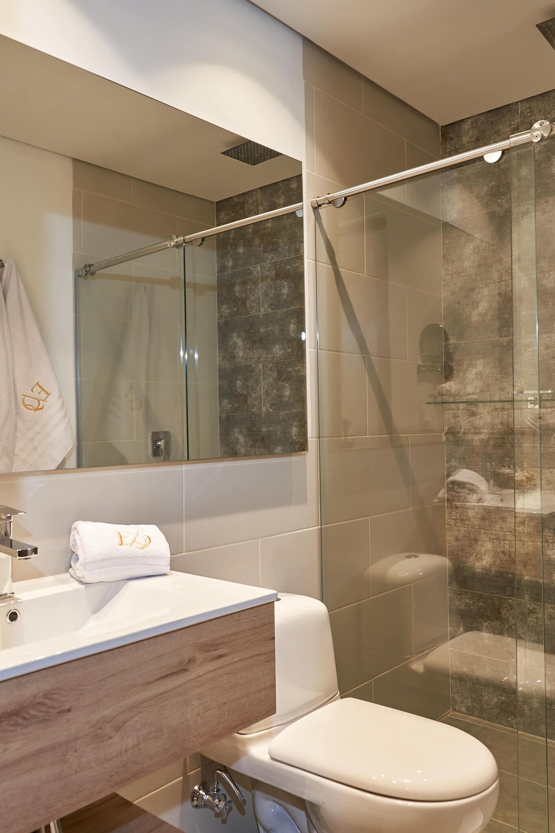 shower, rainfall showerhead, hair dryer, towels