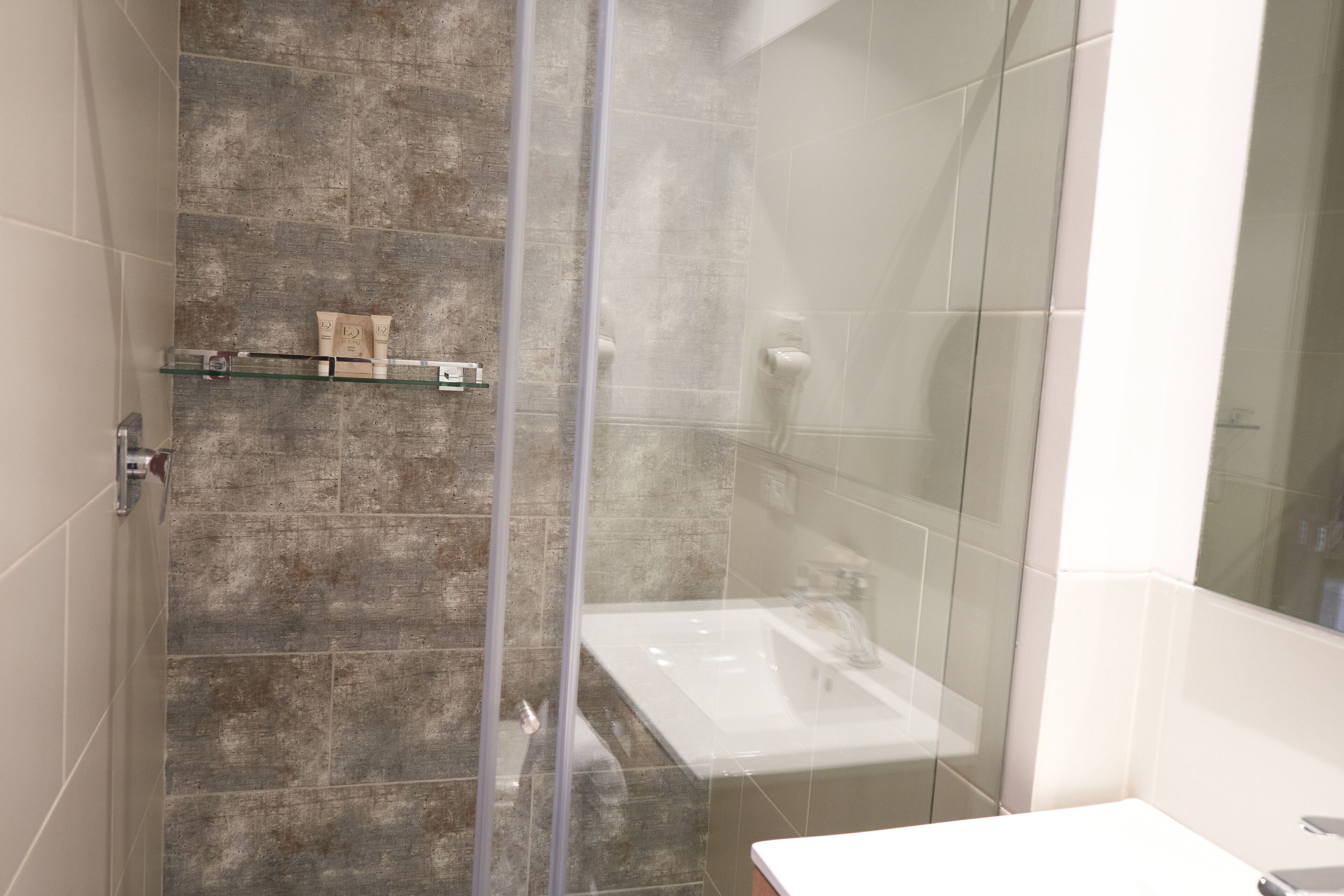 shower, rainfall showerhead, hair dryer, towels