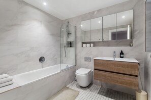 Shower, hair dryer, towels, soap